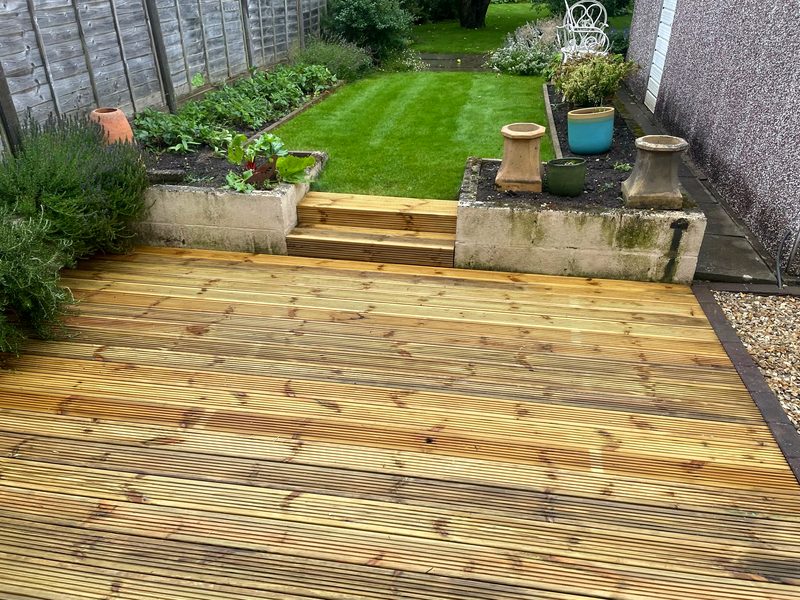 Timber decking with sleeper-edged borders